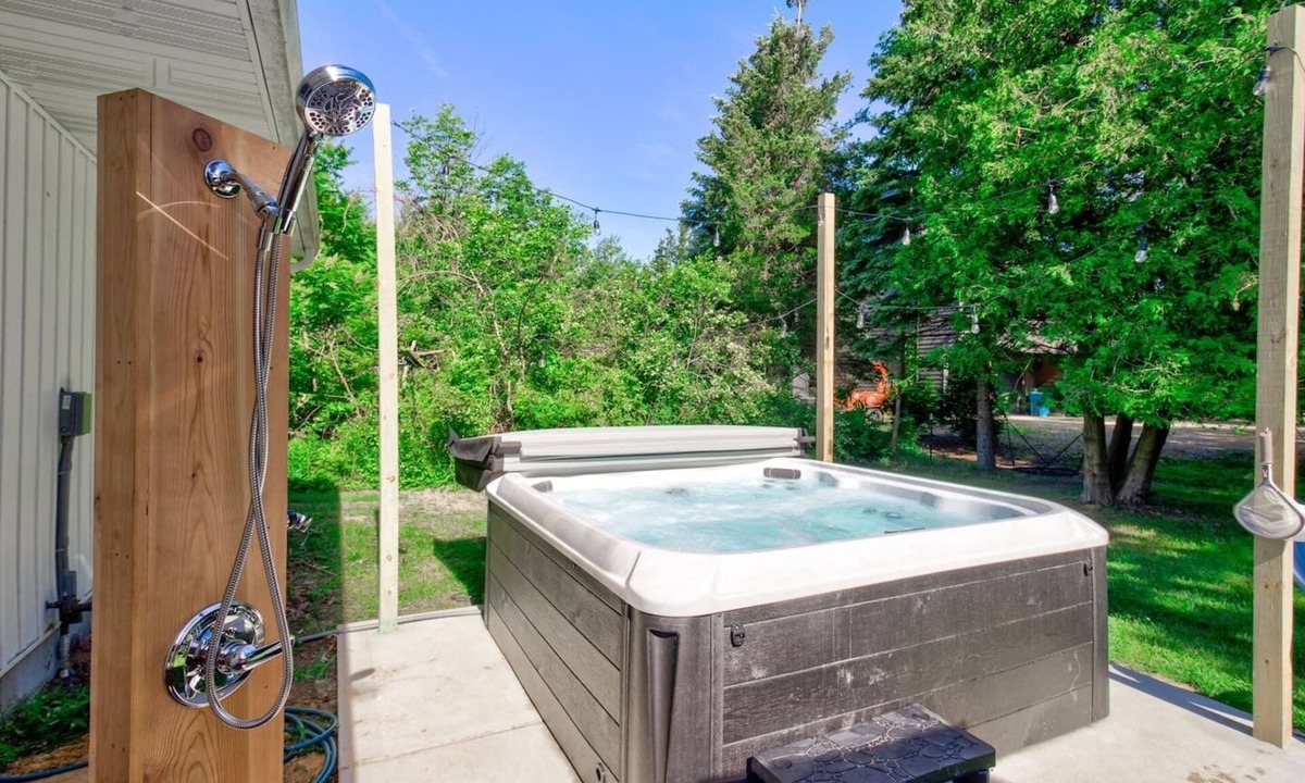 Miami Park House | Escape to our 3BR South Haven home in an exclusive community, just a 5-min walk to a private Lake Michigan beach. Comfortably sleeps 8. Features a private hot tub, chef's kitchen, and cozy fireplace. Perfect for families