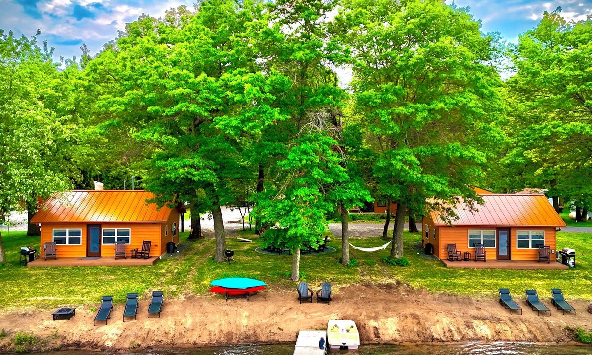 Spooner Cottage | NEW 2 Cottages on the Lake Spooner WI Steps from sand of McKenzie Lake Sleeps 12