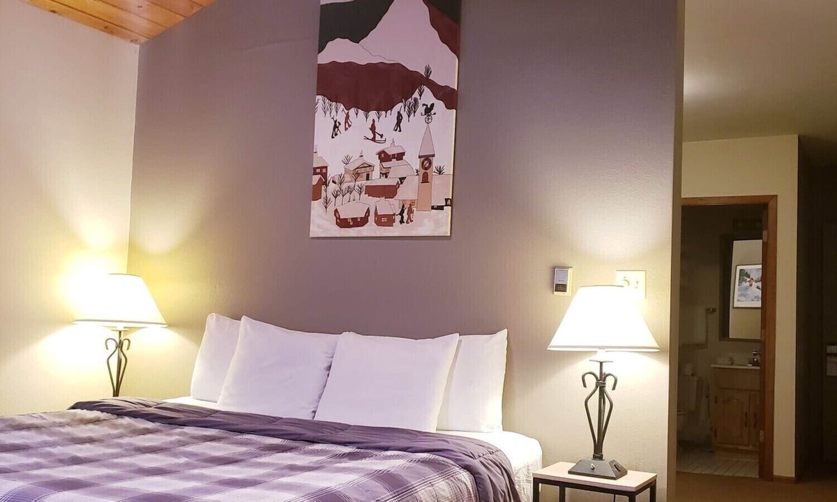 Ironwood Hotel | Private King Suite ideal for couples/romantic stays, and single travelers featuring a beautiful knotty pine vaulted ceiling. Dog friendly!