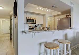 Oceanfront 2BR/2BA condo with pool, balcony, and beach access.