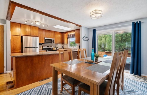 Romulus House | A dreamy Seneca Lake retreat with sweeping views, a relaxing hot tub under the stars, flexible bedroom setups, a fully stocked kitchen, cozy living spaces, and easy access to the lake, wineries, and waterfalls.
