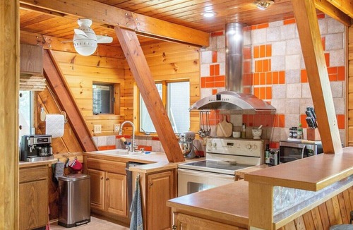Thompsonville Cabin | A-Frame Cabin on Betsie River – Private Dock & Fishing Near Crystal Mountain