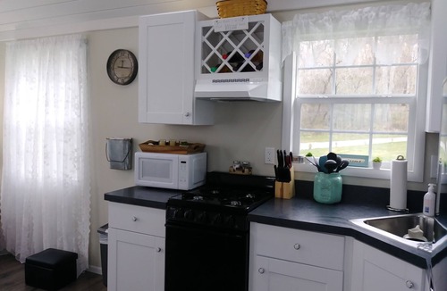 Cherry Creek Cottage | Charming Tiny Cottage in Serene Garden Setting – Perfect Country Getaway!