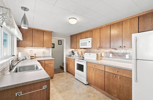 Beulah House | Classic Crystal Lake Cottage with Dock, Mooring Buoy, Fire Ring & Beach Area