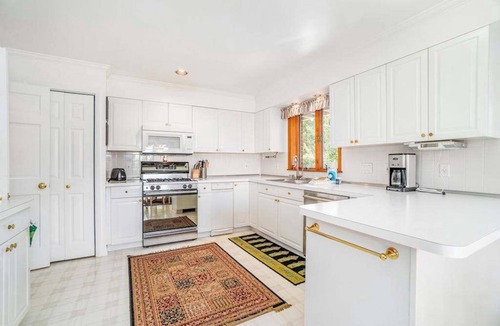 Arcadia House | Dog-friendly, lake view home with three season room, fireplace, video projector