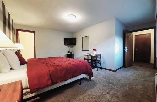 Ironwood Cabin | Dog Friendly main level king room inside the Lodge at North Ironwood Acres resort.