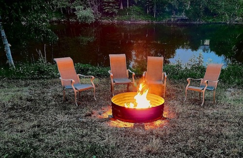 Hessel Cabin | Riverfront Cabin Incredible for Outdoor Enthusiasts with Kayaks in Hessel, Michigan