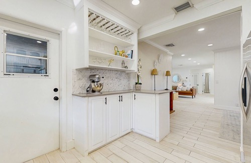 Santa Barbara Estates House | Tropical backyard oasis w/putting green, grill, tiki bar & walk to beach