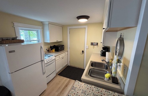 Traverse City Cottage | Waterfront directly on Lake Leelanau!Cottage with beach and fire pits!