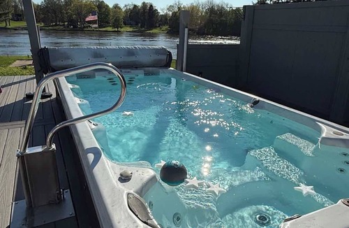 Phoenix House | Waterfront House with Outdoor Heated Swim Spa & Fire Pit