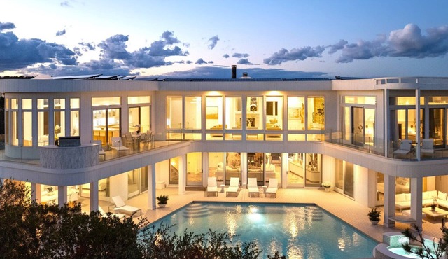 An awe-inspiring 8,000 SF custom oceanfront mansion retreat on two.