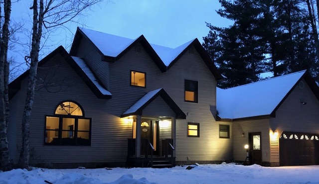 Beautiful 4 bedroom 2 bath home on the Au Train River blocks from the beach