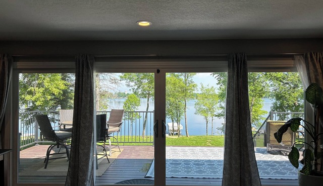 Beautiful deck overlooking Maple Lake with private, shared dock.