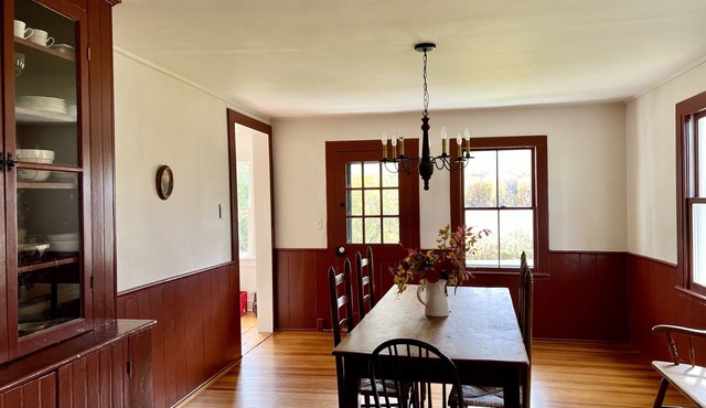 Charming 1800s home with fenced in yard and bucolic farm views !