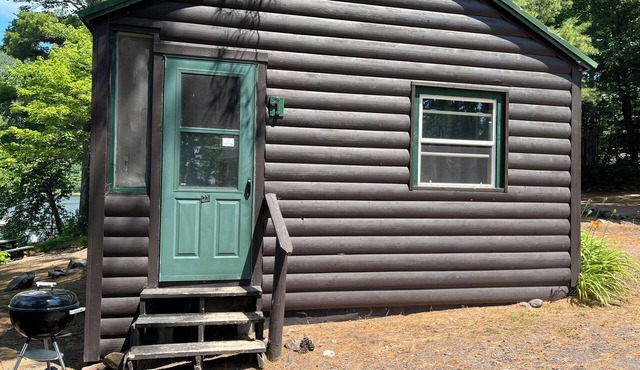 Charming Resort Cabin Steps from the Water and Campfire Evenings
