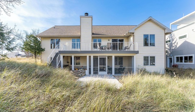 Experience lakeside luxury at Sunset Cove, a spacious 5-bedroom home