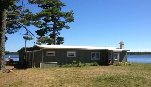 Lakefront, spectacular views with water on both sides, deep water dock.