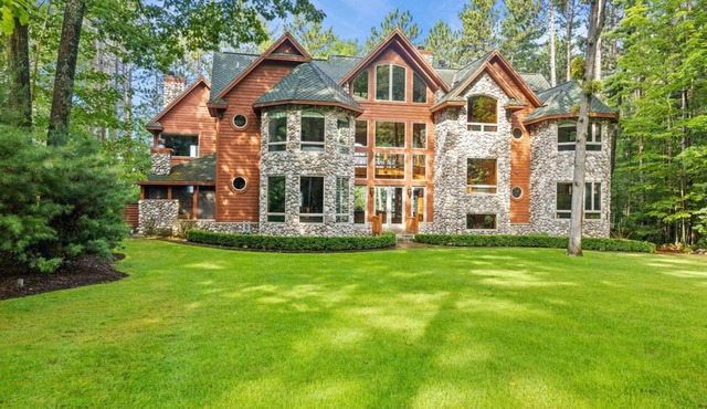 Luxurious 11,600 SQ' Mullett Lake Home & Carriage house,Private on Mullett Lake