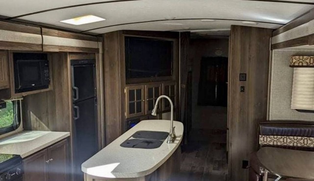 Private camp site on Sand Pond, nicely furnished RV & your own private dock!