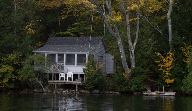 Private three season cabin nestled in woods on shore of pristine Maine lake