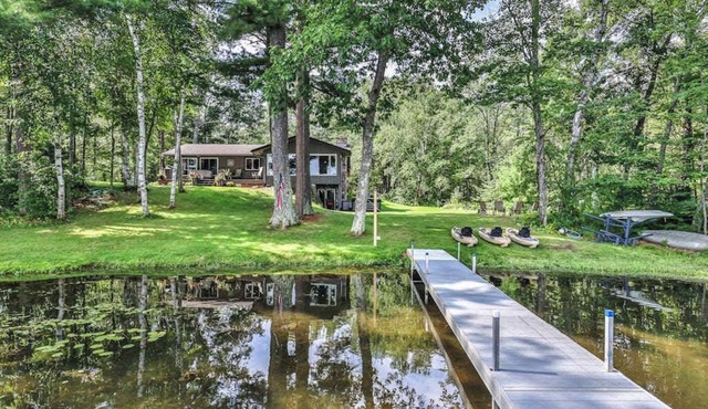 Private waterfront home with dock, kayaks, firepit, & open layout - dog-friendly