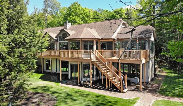 Private waterfront lake, sand beach, bar that seats 12, game room,