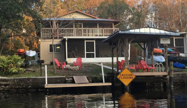 Spacious home on clear canal just a few houses from the main river includes kayaks and pool table!