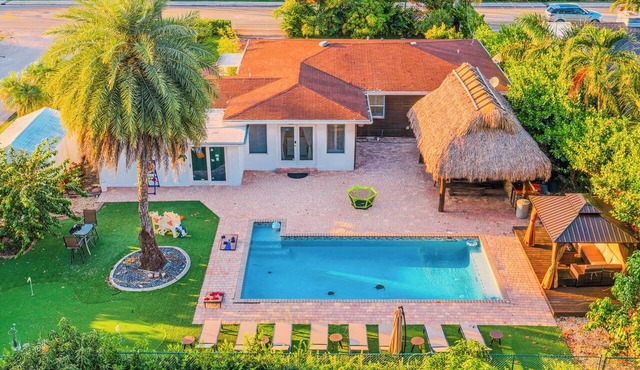 Tiki Oasis with outside kitchen Game Room Fire Pit 4BR Retreat Pool