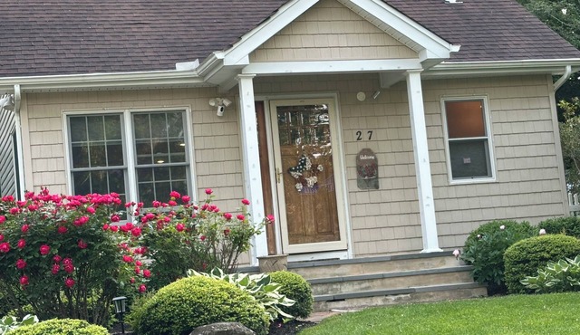 Walk to beach in this charming home with ac and wifi